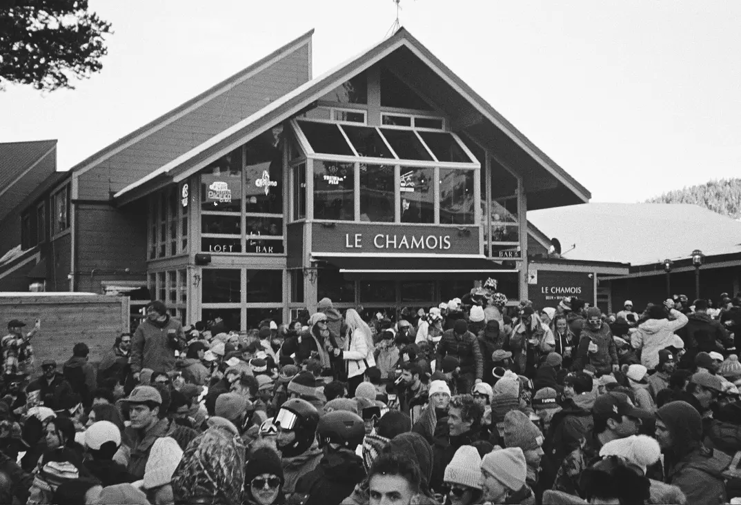 Crowd gathered outside a ski lodge